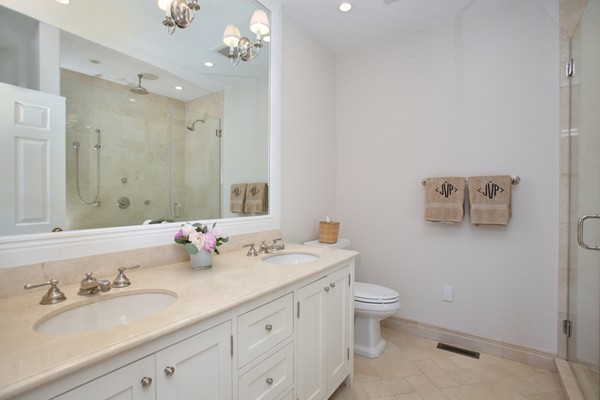 123 Charles Street, Unit 3 Boston, MA 02114 - Photo 11 of 18 a bathroom with a granite countertop sink mirror and toilet