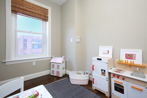 123 Charles Street, Unit 3 Boston, MA 02114 - Photo 14 of 18 a room with furniture and a window