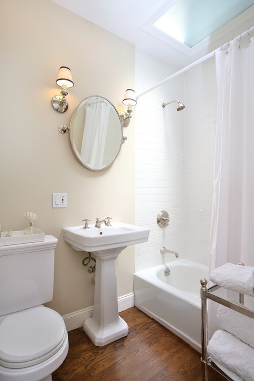 123 Charles Street, Unit 3 Boston, MA 02114 - Photo 15 of 18 a bathroom with a sink a toilet and a bathtub