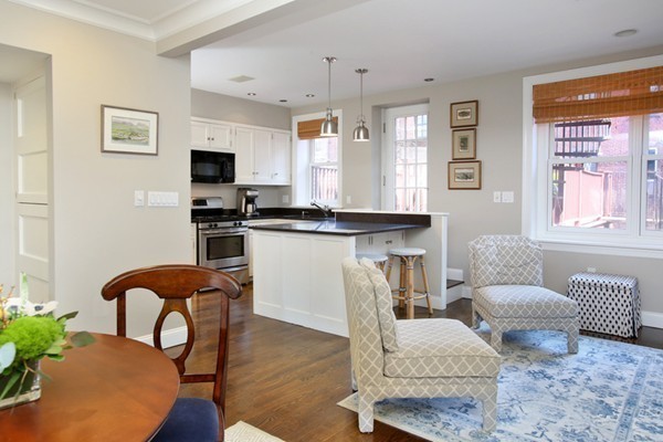 123 Charles Street, Unit 3 Boston, MA 02114 - Photo 4 of 18 a living room with furniture a dining table and with potted plants