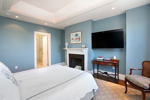 123 Charles Street, Unit 3 Boston, MA 02114 - Photo 9 of 18 a bedroom with a bed and a flat screen tv