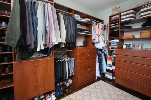 123 Charles Street, Unit 3 Boston, MA 02114 - Photo 10 of 18 a view of walk in closet with clothes and shoes