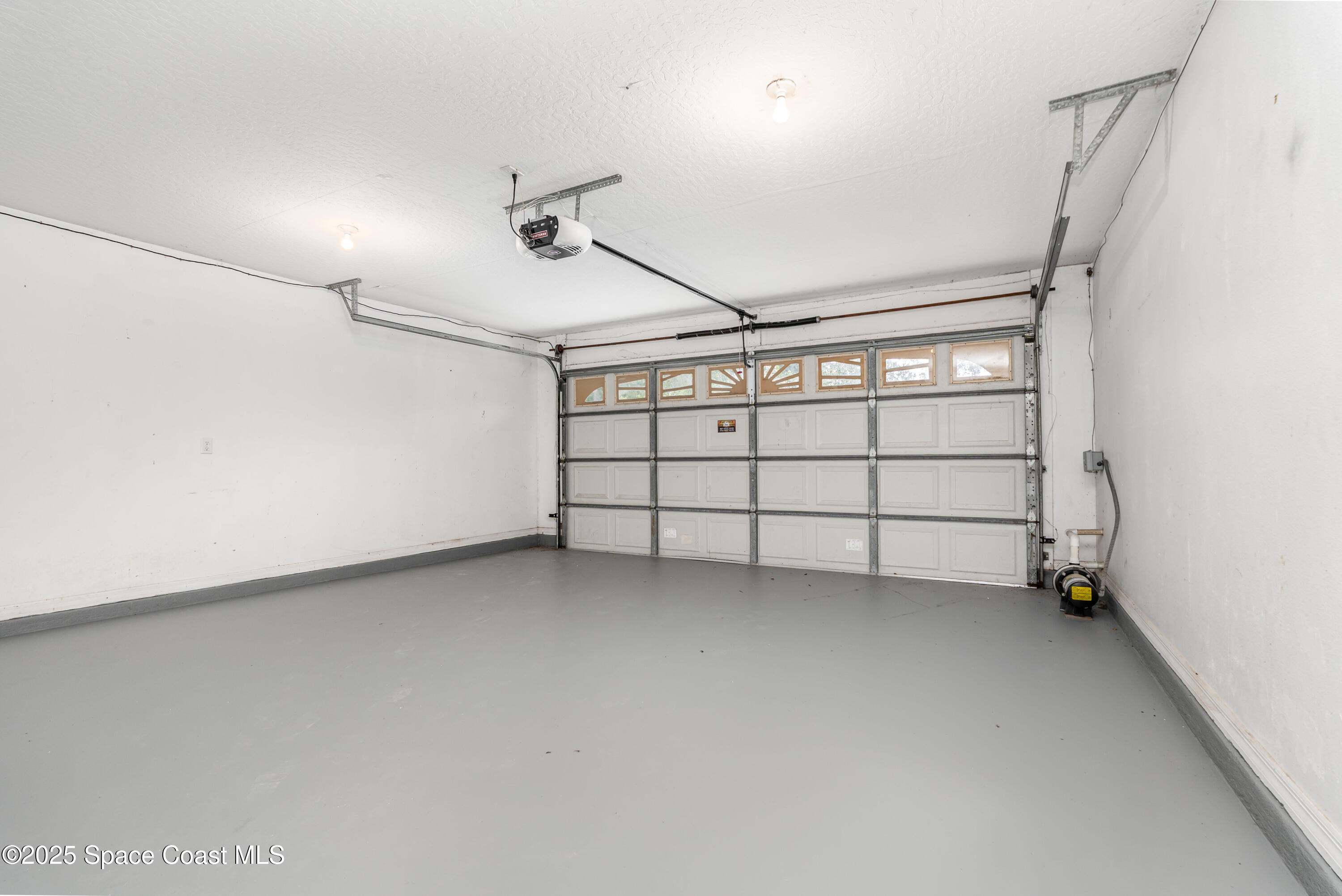 320 Myrtlewood Road Melbourne, FL 32940 - Photo 14 of 18 a view of a garage