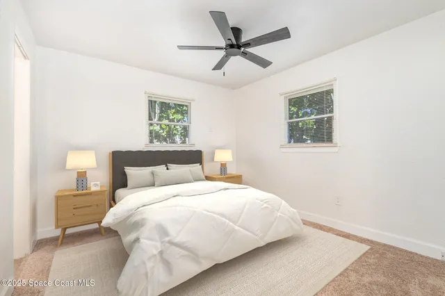 a bedroom with a bed and window