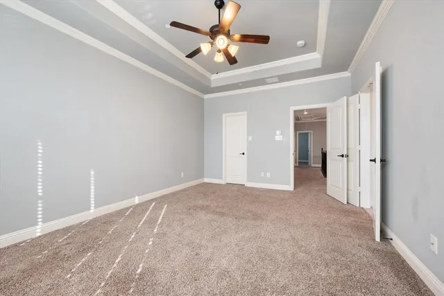 a view of a livingroom with a ceiling fan and window
