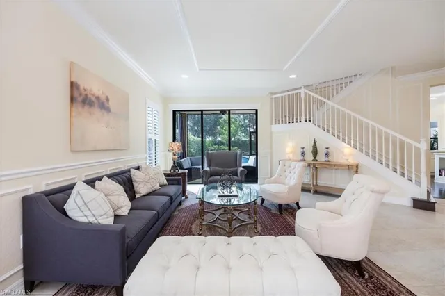 a living room with furniture or couch and a large window