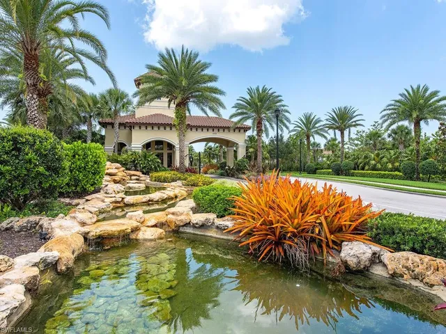 a view of swimming pool with a garden and patio