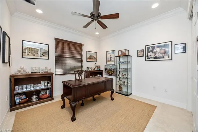 a view of a livingroom with workspace and a couch