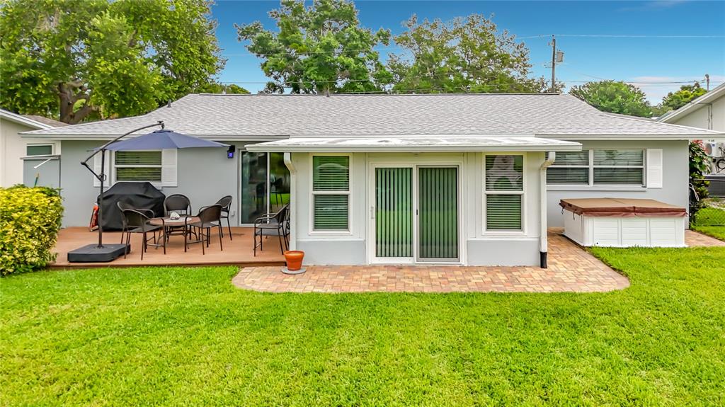 508 Shore Drive Largo, FL 33771 - Photo 23 of 31 a view of a house with a backyard porch and sitting area