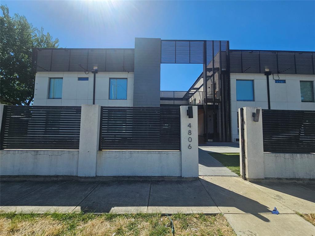 4806 Virginia Avenue, Unit 108 Dallas, TX 75204 - Photo 1 of 9 a view of a house with a door and wooden floor