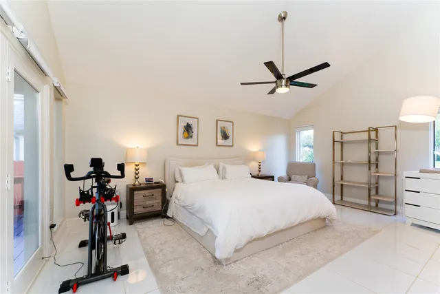 a bedroom with a bed a desk and chair