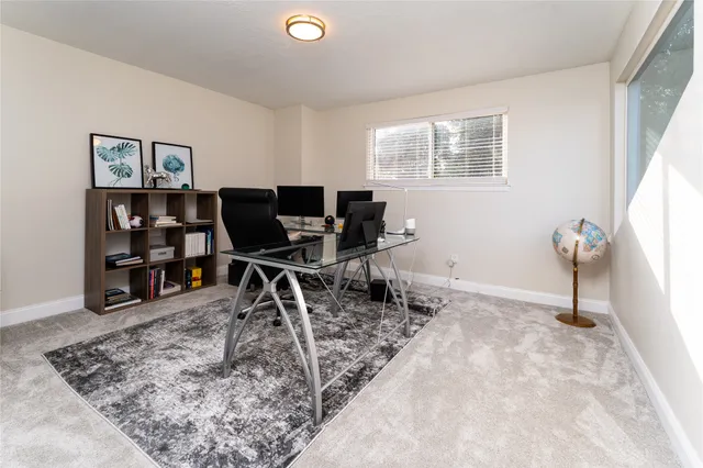 a view of a workspace with furniture