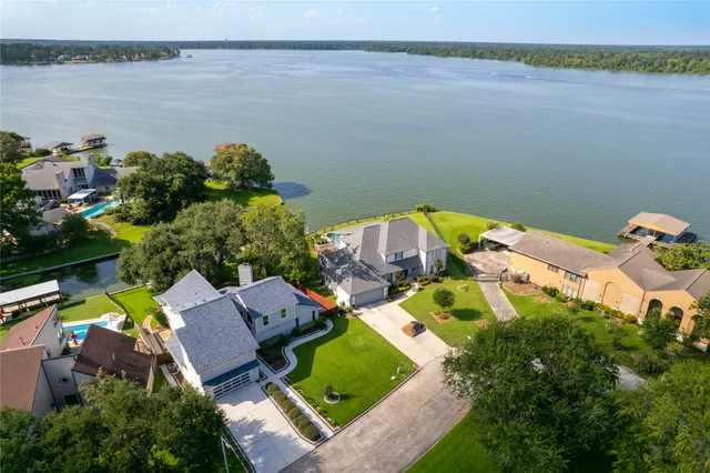 an aerial view of a house with a lake view