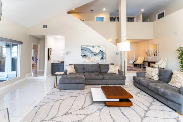 a living room with furniture and a couch