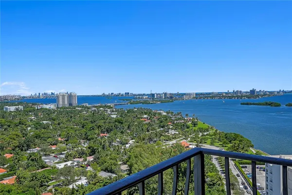 a view of a green landscape from a balcony