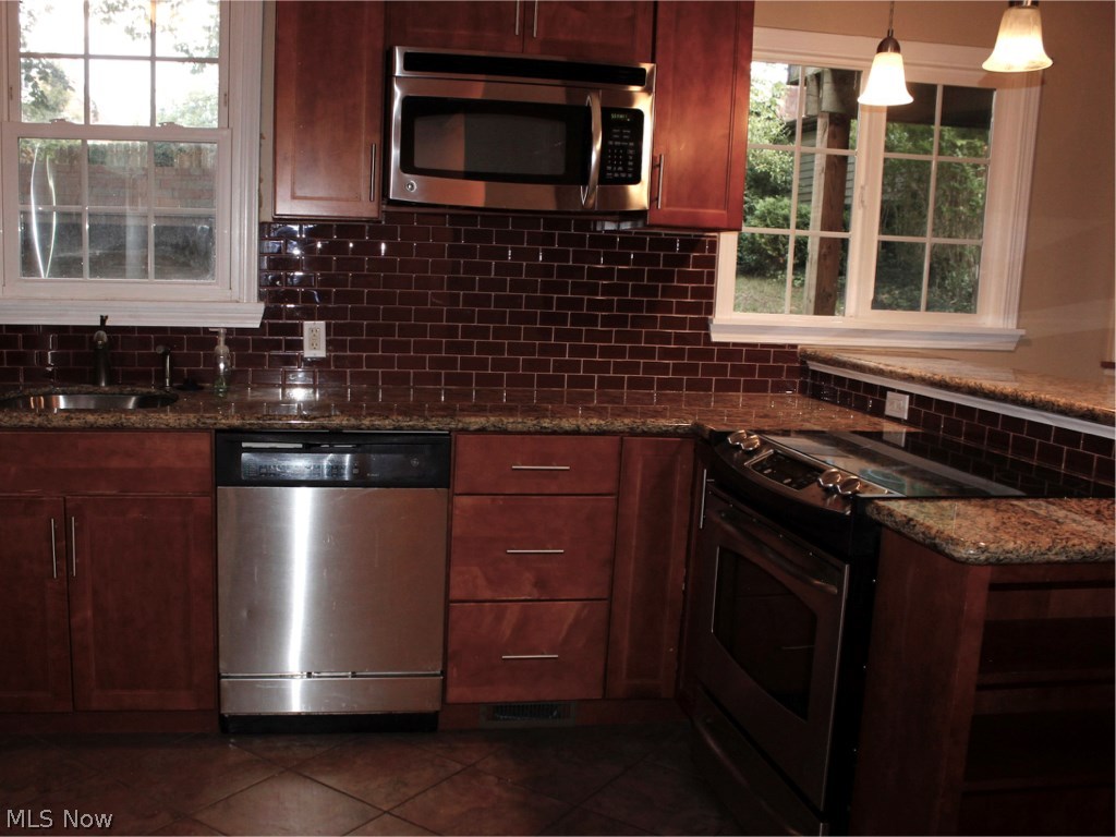 2187 Edgerton Road Cleveland, OH 44118 - Photo 6 of 14 KITCHEN HAS IT ALL....GRANITE COUNTER TOPS, STAINLESS STEEL APPLIANCES....ETC.ETC.ETC.