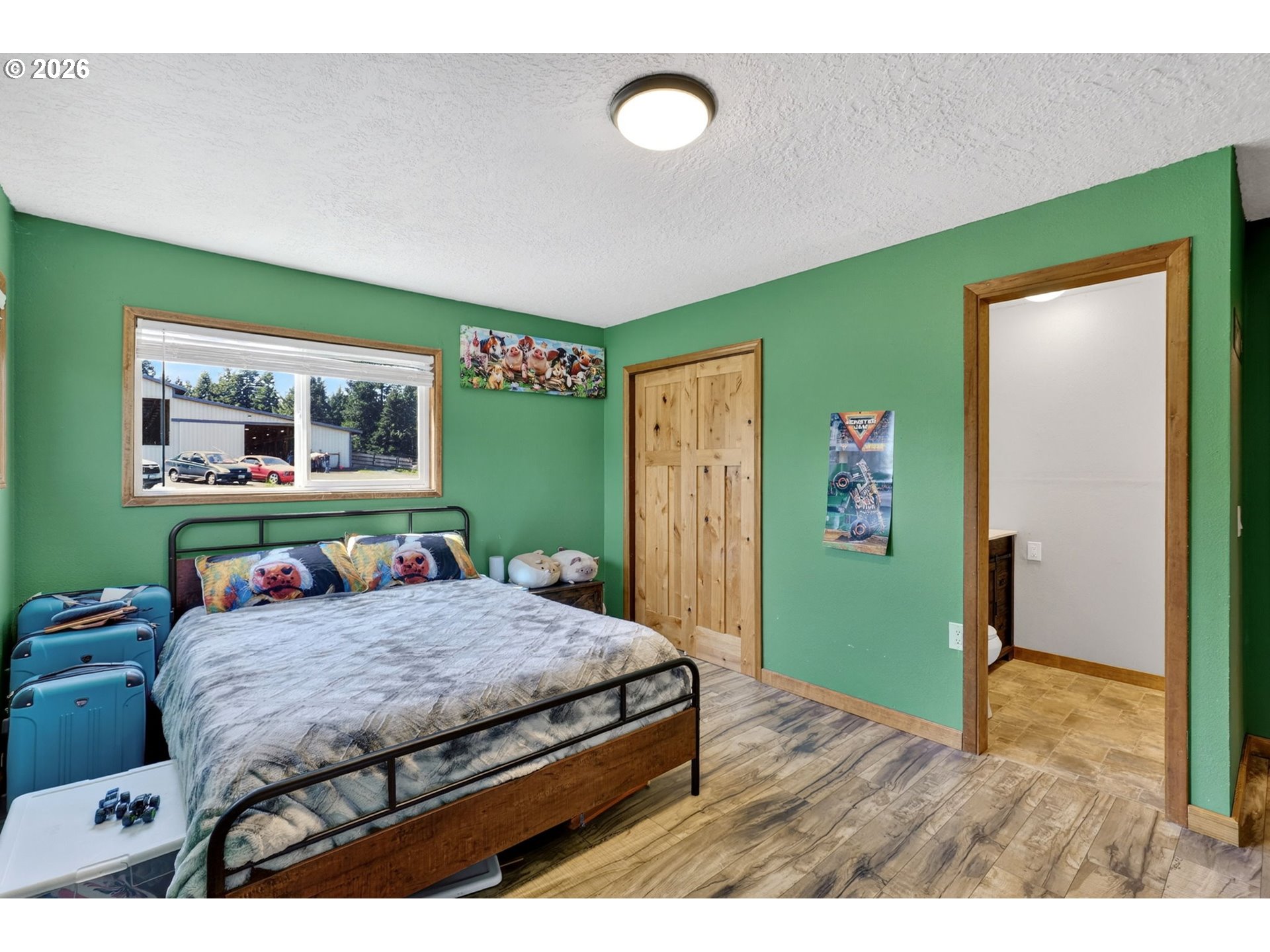 17623 South Windy City Road Mulino, OR 97042 - Photo 13 of 48 a bedroom with a bed and a bookshelf