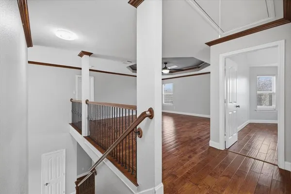 a view of entryway and hall with wooden floor