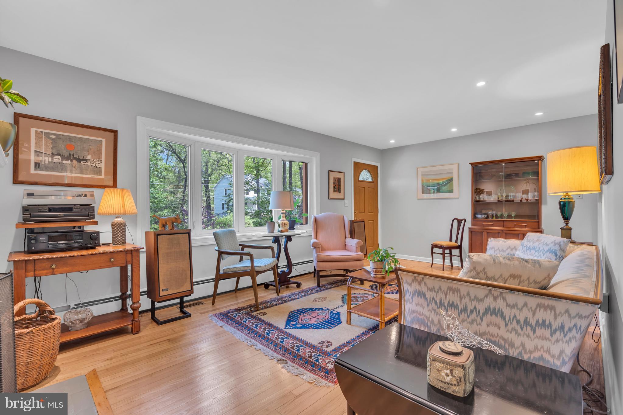801 Mt Lucas Road Princeton, NJ 08540 - Photo 11 of 39 a living room with furniture and a floor to ceiling window