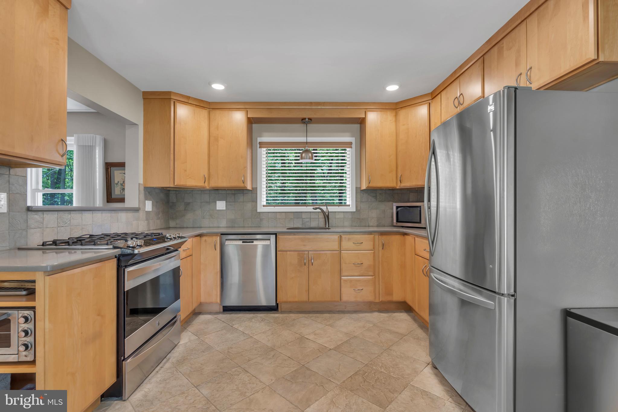 801 Mt Lucas Road Princeton, NJ 08540 - Photo 3 of 39 a kitchen with stainless steel appliances granite countertop a refrigerator a stove a sink and a microwave