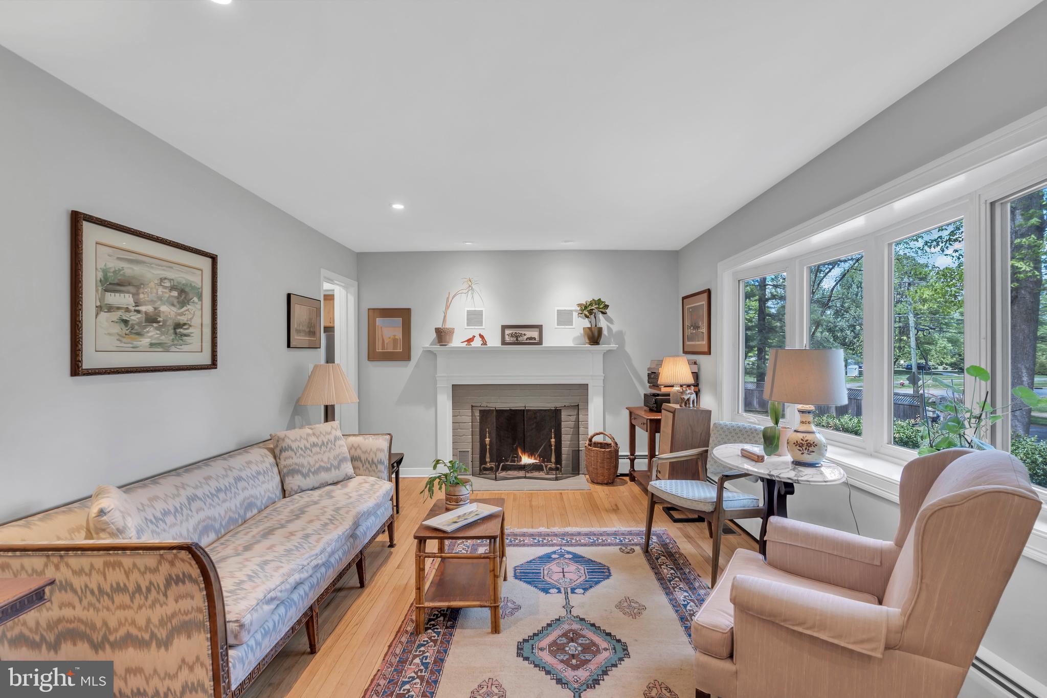 801 Mt Lucas Road Princeton, NJ 08540 - Photo 9 of 39 a living room with furniture large window and a fireplace