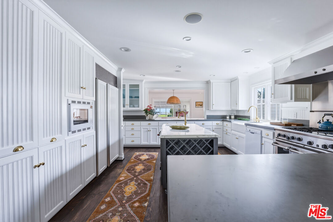 30810 Broad Beach Road Malibu, CA 90265 - Photo 15 of 55 a kitchen with stainless steel appliances a refrigerator sink and stove