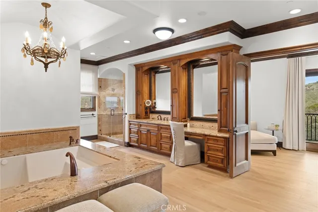 a bathroom with a tub and a shower