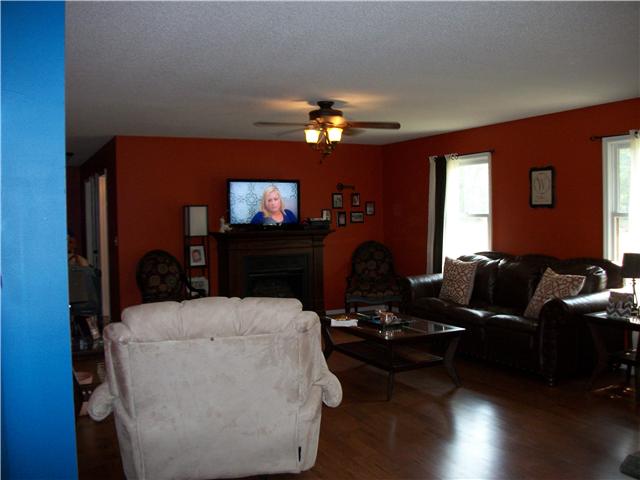283 John Sugg Road Fayetteville, TN 37334 - Photo 7 of 16 Nice FP and Laminate flooring in Living Rm.