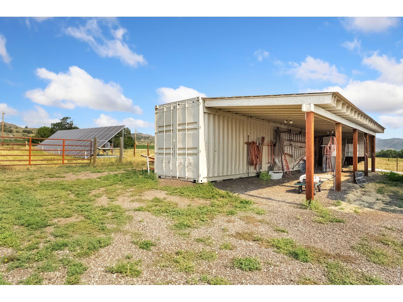 54 Rist View Road Bellvue, CO 80512 - Photo 46 of 50 Shipping Container and covered adjacent with lighting and power