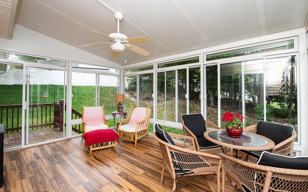 6 Innisfree Drive Haverhill, MA 01832 - Photo 11 of 41 a living room filled with furniture and floor to ceiling windows