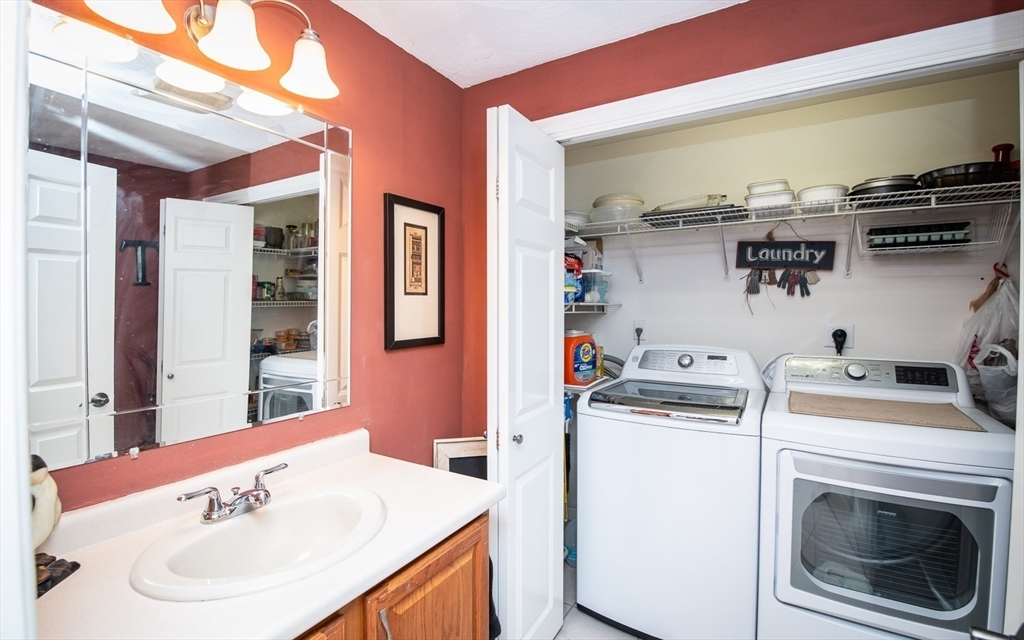 6 Innisfree Drive Haverhill, MA 01832 - Photo 12 of 41 a bathroom with a sink and a washer dryer