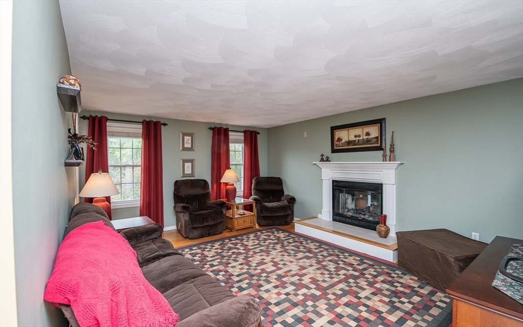 6 Innisfree Drive Haverhill, MA 01832 - Photo 14 of 41 a living room with furniture and a fireplace