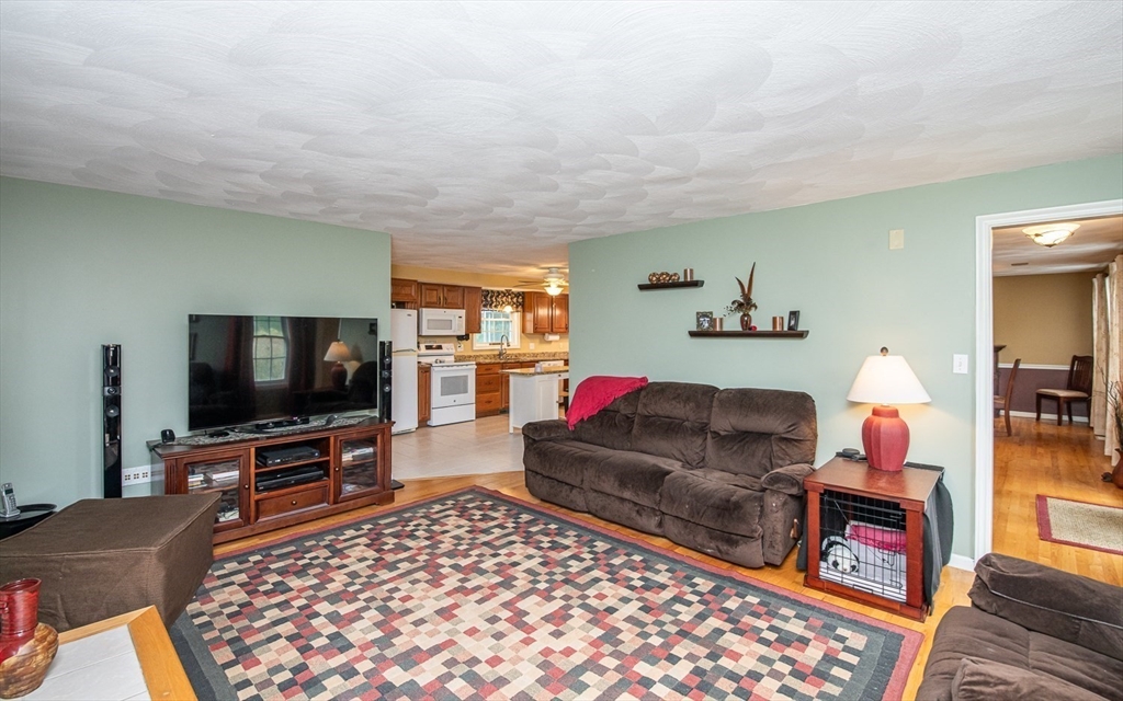 6 Innisfree Drive Haverhill, MA 01832 - Photo 15 of 41 a living room with furniture and a flat screen tv