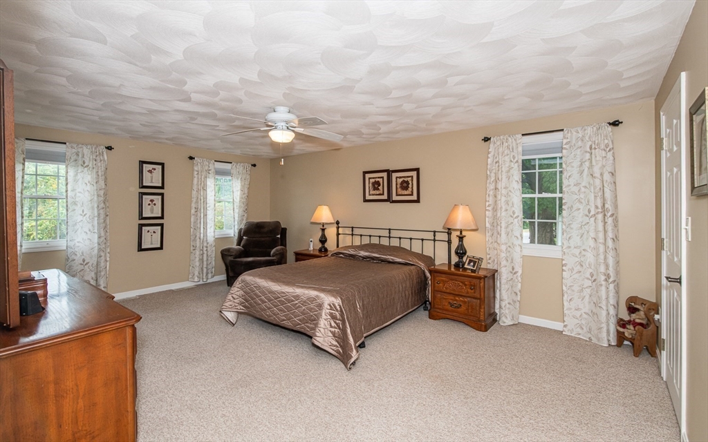 6 Innisfree Drive Haverhill, MA 01832 - Photo 20 of 41 a spacious bedroom with a bed and furniture
