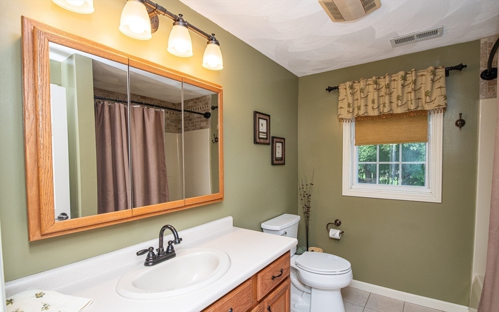 6 Innisfree Drive Haverhill, MA 01832 - Photo 25 of 41 a bathroom with a sink a toilet and shower