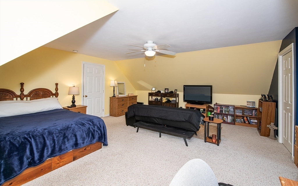 6 Innisfree Drive Haverhill, MA 01832 - Photo 31 of 41 a bedroom with a bed and a couch