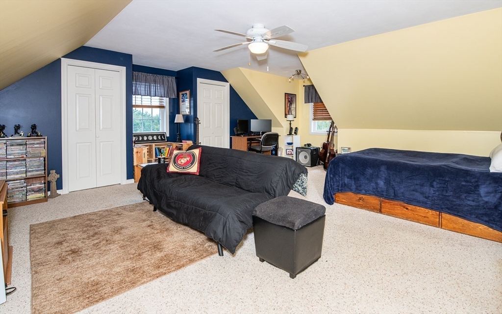6 Innisfree Drive Haverhill, MA 01832 - Photo 32 of 41 a living room with furniture and a flat screen tv