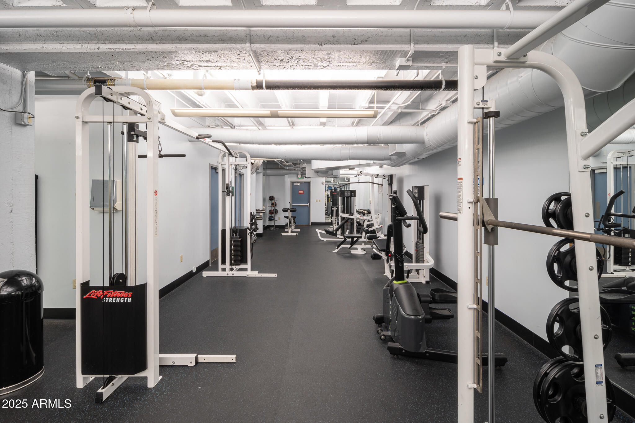 114 West Adams Street, Unit 402 Phoenix, AZ 85003 - Photo 18 of 25 a view of a room with gym equipment