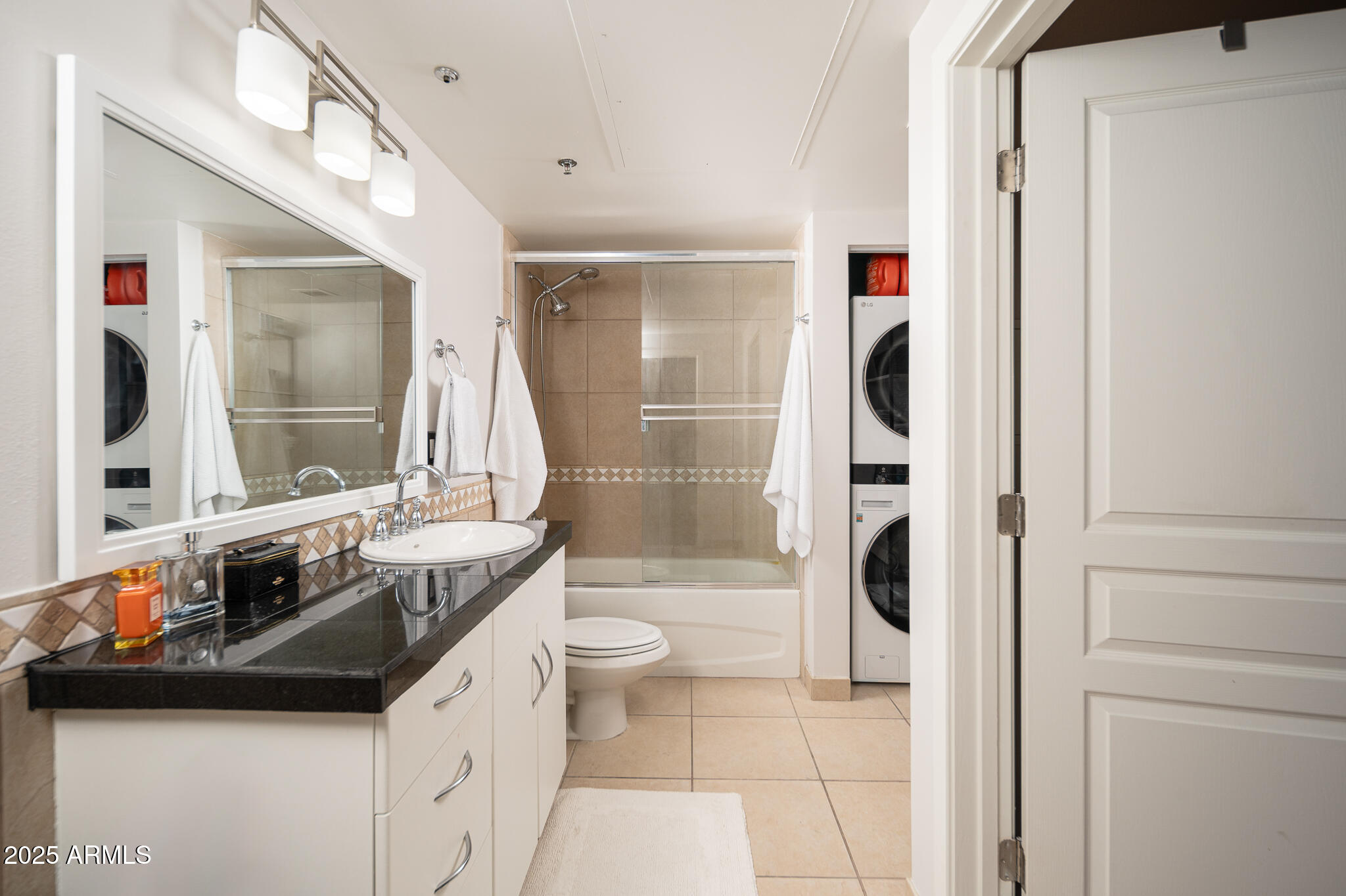 114 West Adams Street, Unit 402 Phoenix, AZ 85003 - Photo 2 of 25 a bathroom with a sink a toilet and shower