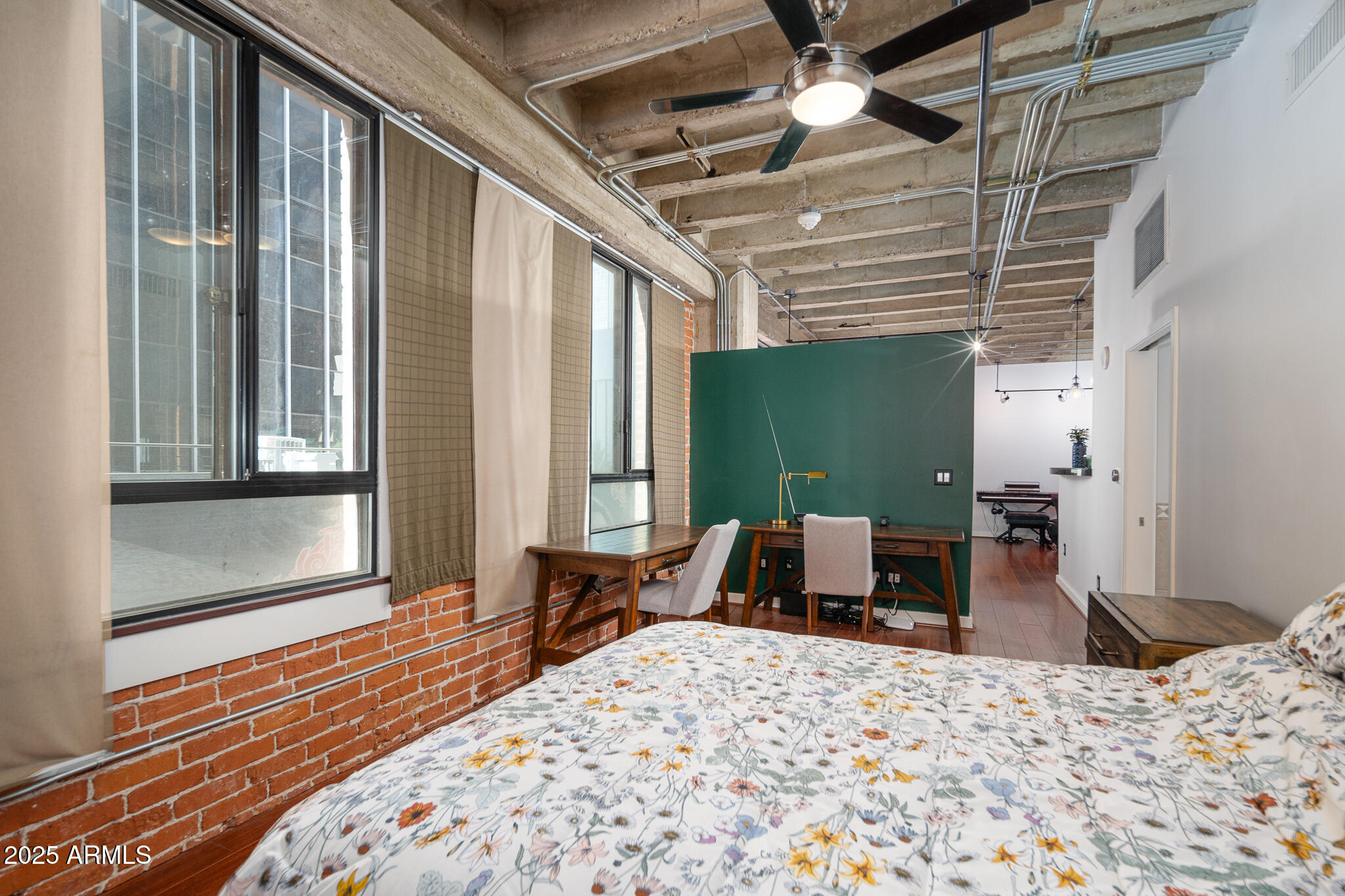 114 West Adams Street, Unit 402 Phoenix, AZ 85003 - Photo 21 of 25 a bedroom with a bed and a large window