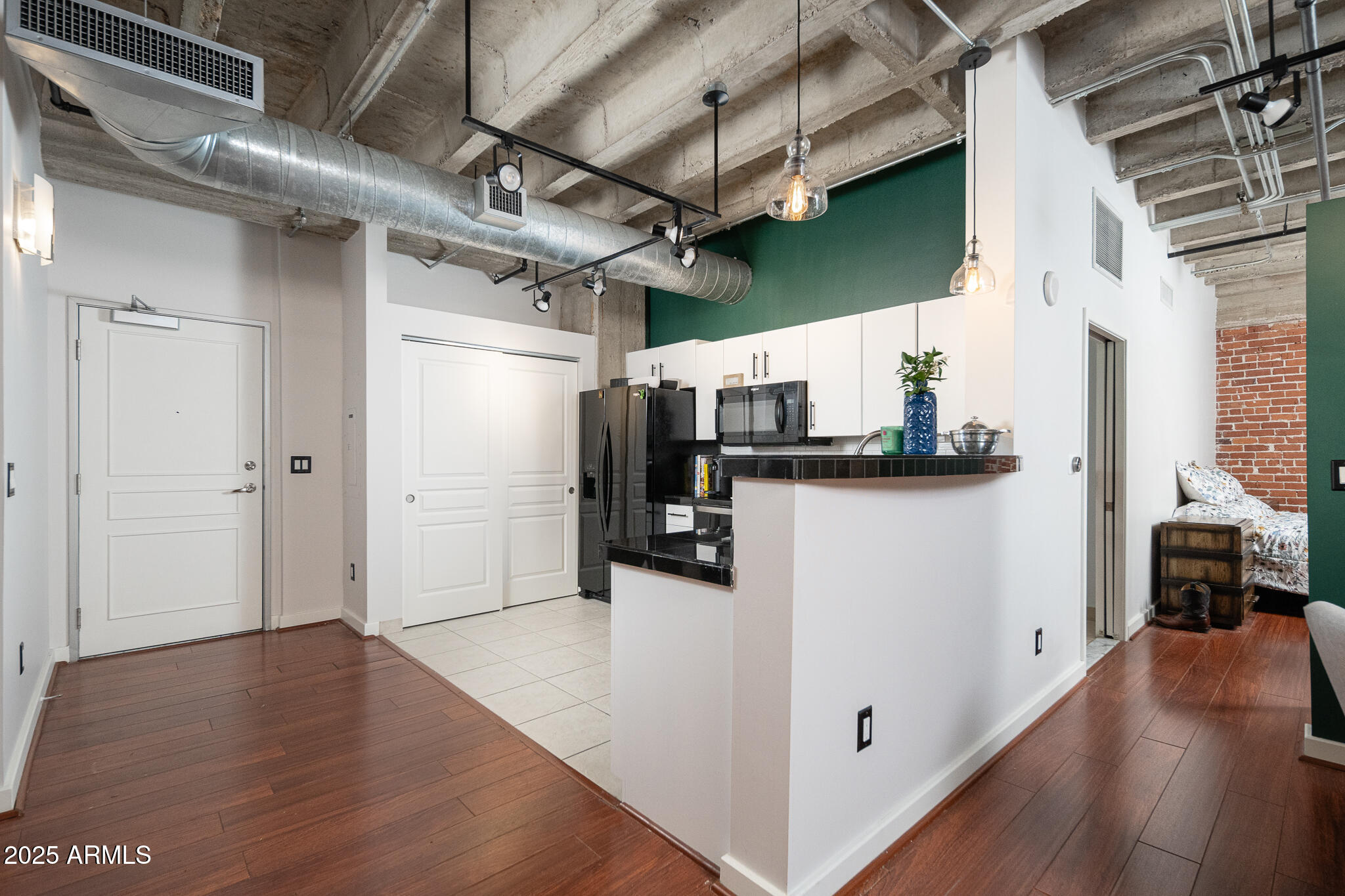 114 West Adams Street, Unit 402 Phoenix, AZ 85003 - Photo 24 of 25 a view of a hallway with wooden floor