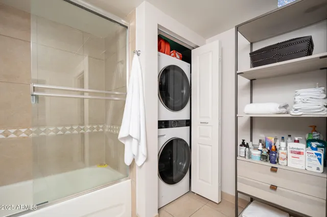 a room with pool table and windows