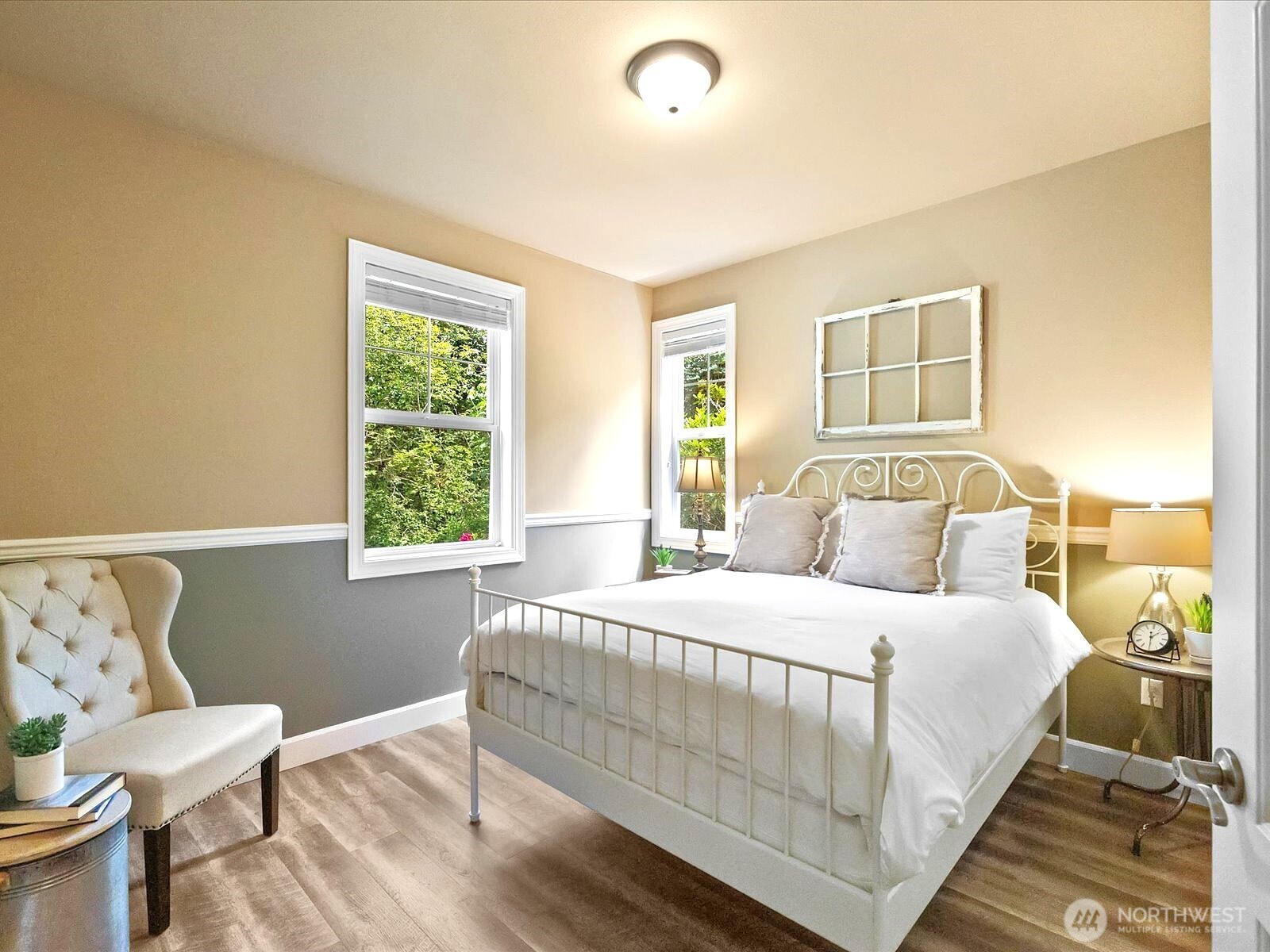 33606 Northeast Lake Joy Road Carnation, WA 98014 - Photo 22 of 40 a bedroom with a bed and wooden floor