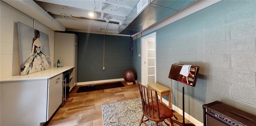 5 Foster Square Pittsburgh, PA 15212 - Photo 18 of 25 a hallway with table and a chandelier