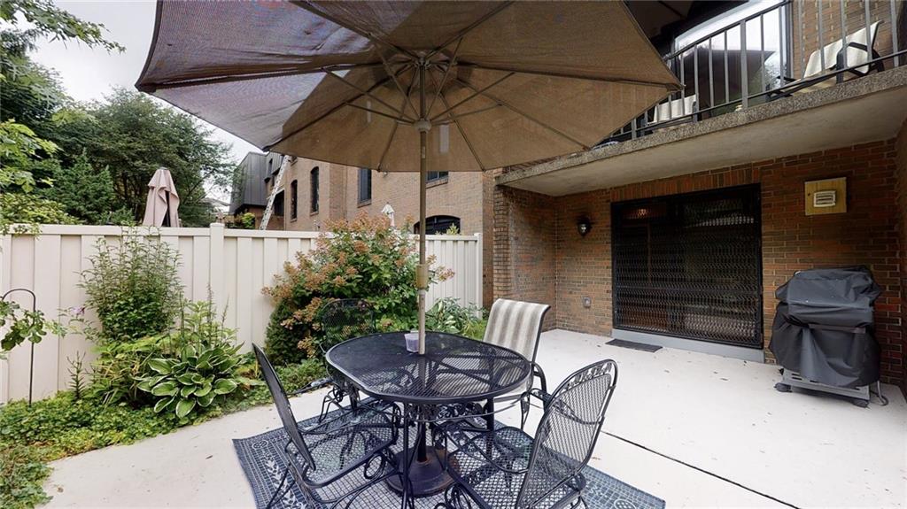 5 Foster Square Pittsburgh, PA 15212 - Photo 21 of 25 a view of a patio with table and chairs under an umbrella