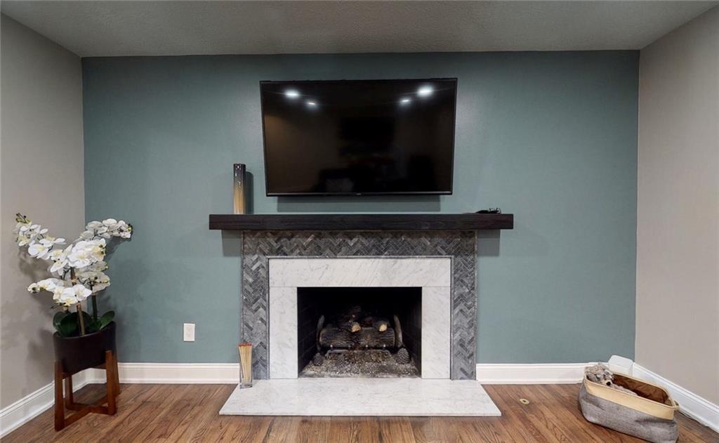 5 Foster Square Pittsburgh, PA 15212 - Photo 6 of 25 a living room with a fireplace furniture and a potted plant
