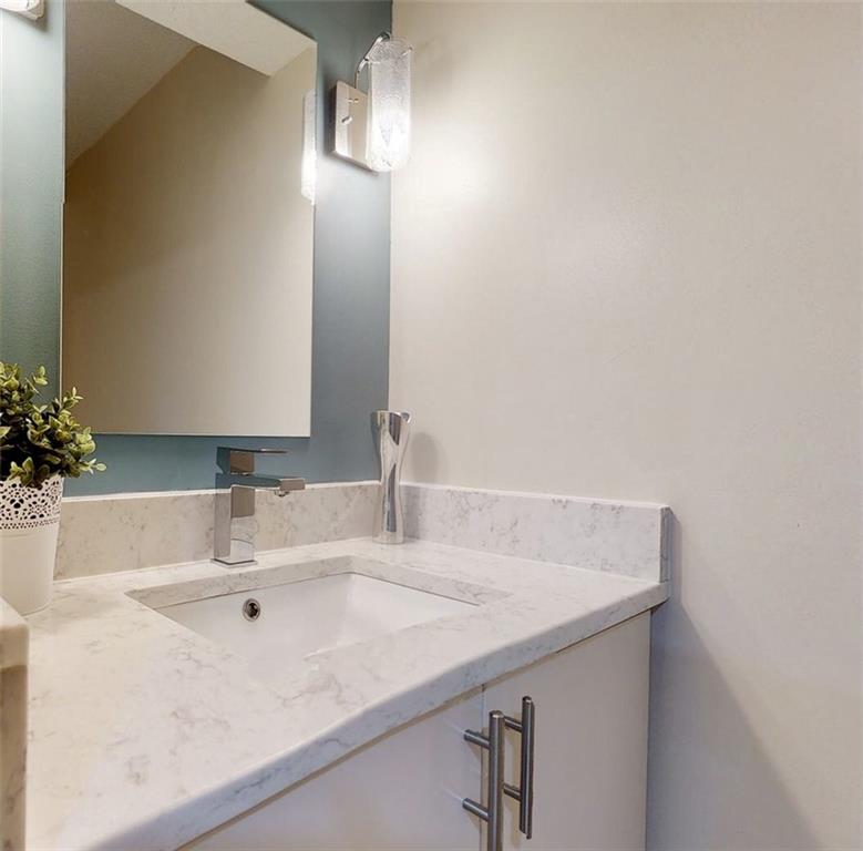 5 Foster Square Pittsburgh, PA 15212 - Photo 10 of 25 a bathroom with a sink and a mirror
