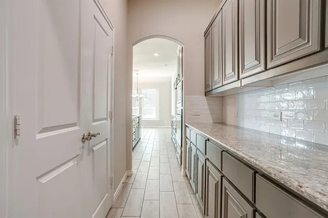 a view of a kitchen from the hallway