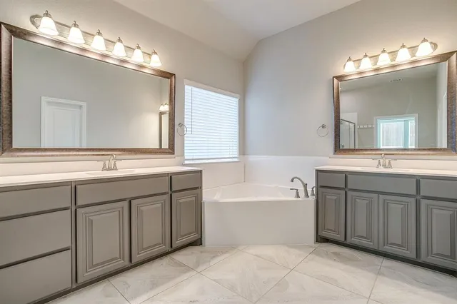 an empty room with a ceiling fan and a window