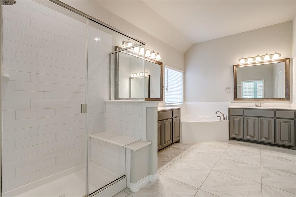 1281 Palo Duro Court Burleson, TX 76028 - Photo 27 of 39 a bathroom with a bathtub sink and mirror